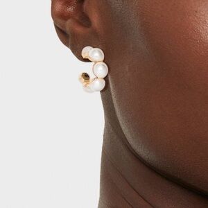 Mini pearl hoop earrings.